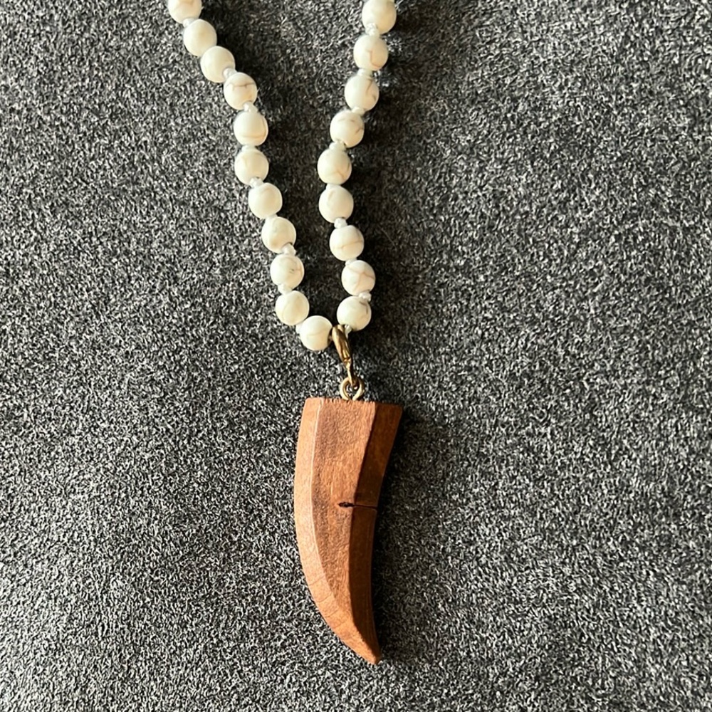 Beaded necklace with wooden horn pendant